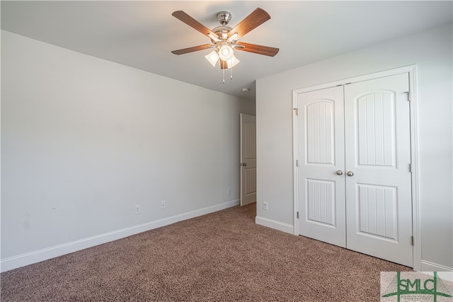 unfurnished bedroom with ceiling fan, light carpet, and a closet