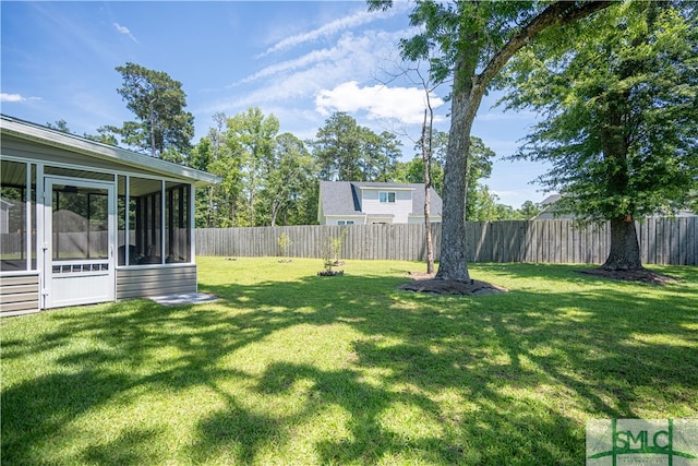 view of yard with a sunroom