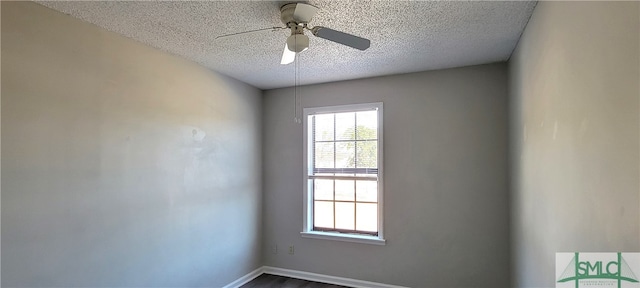 spare room with ceiling fan and a textured ceiling