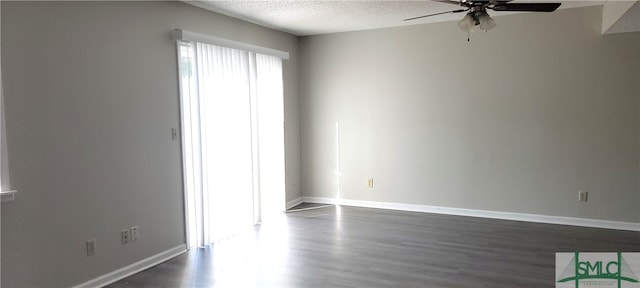 spare room with ceiling fan, hardwood / wood-style floors, and a textured ceiling