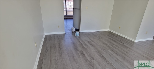 spare room with hardwood / wood-style floors