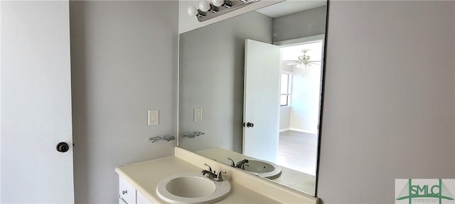 bathroom featuring ceiling fan, vanity, and hardwood / wood-style floors