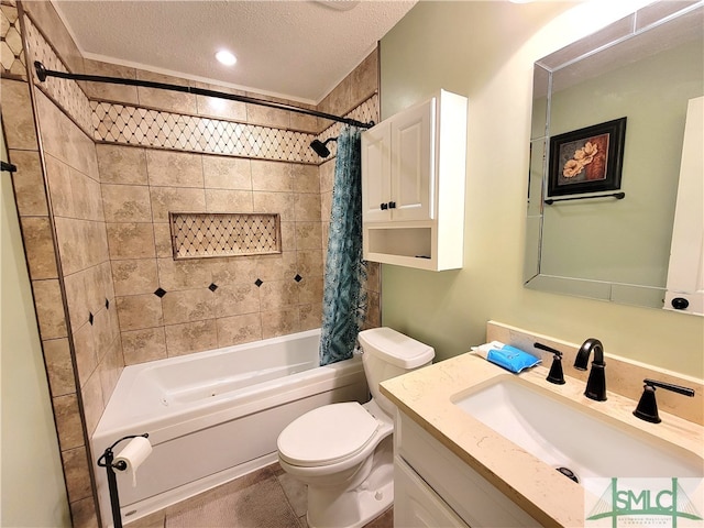 full bathroom with vanity, shower / tub combo, a textured ceiling, and toilet