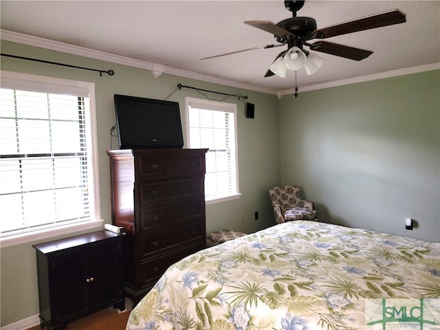 bedroom with ceiling fan and ornamental molding