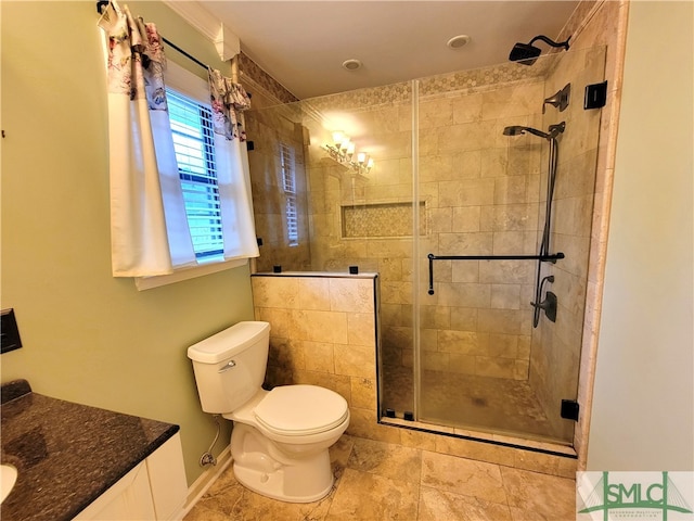 bathroom featuring vanity, toilet, and walk in shower