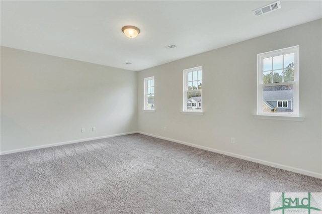 unfurnished room featuring carpet