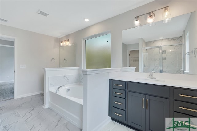 bathroom with vanity and independent shower and bath