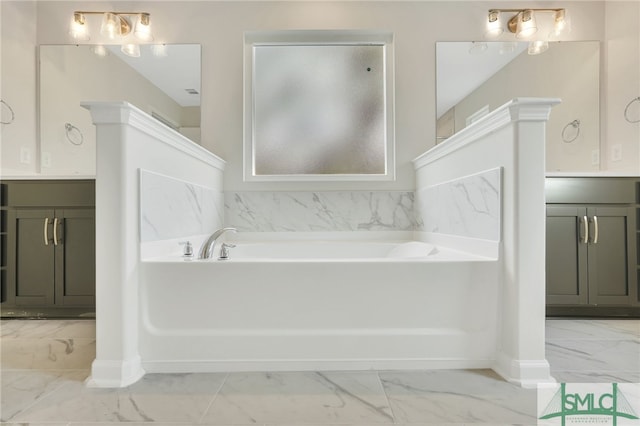 bathroom featuring vanity and a bathtub