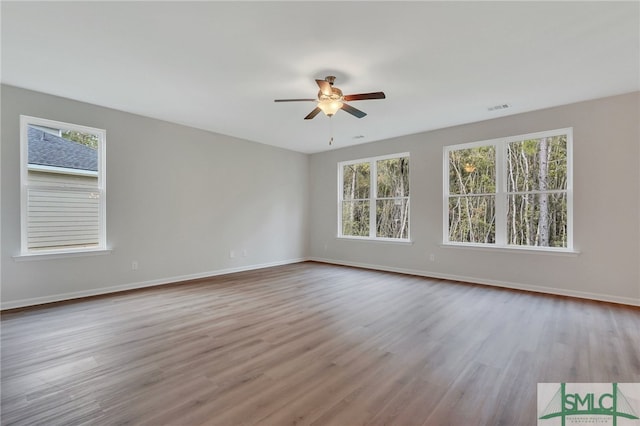 spare room with ceiling fan and light hardwood / wood-style flooring