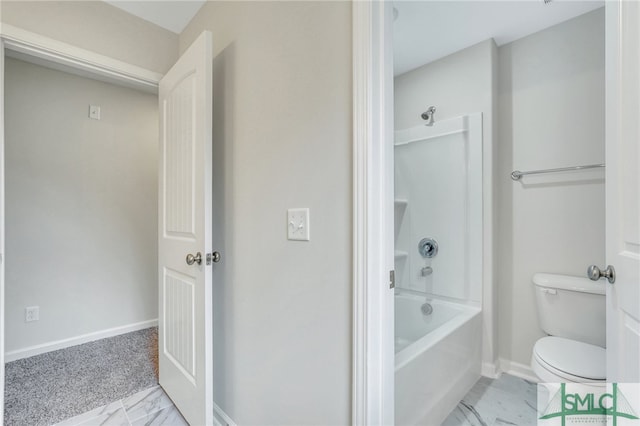 bathroom featuring bathtub / shower combination and toilet