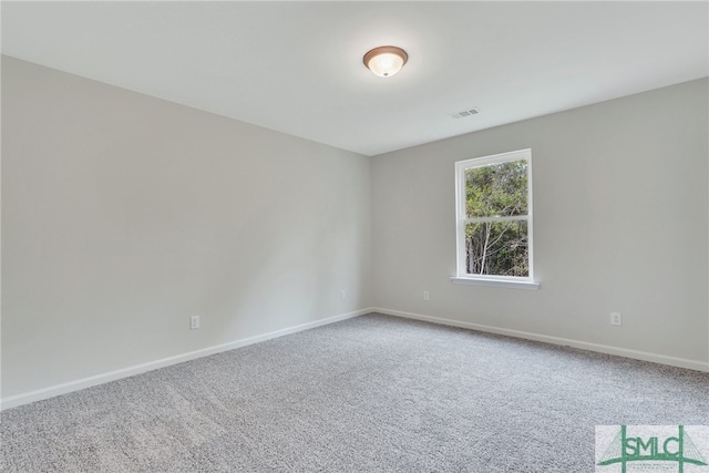 unfurnished room featuring carpet