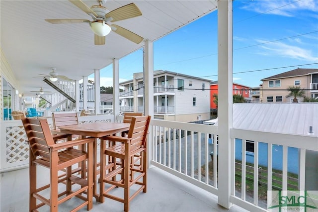 exterior space with ceiling fan