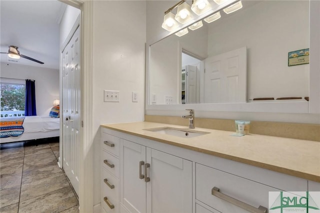 bathroom with ceiling fan and vanity