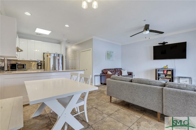 tiled living room featuring crown molding and ceiling fan