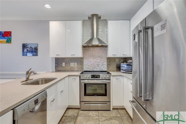 kitchen with wall chimney range hood, stainless steel appliances, white cabinets, and sink