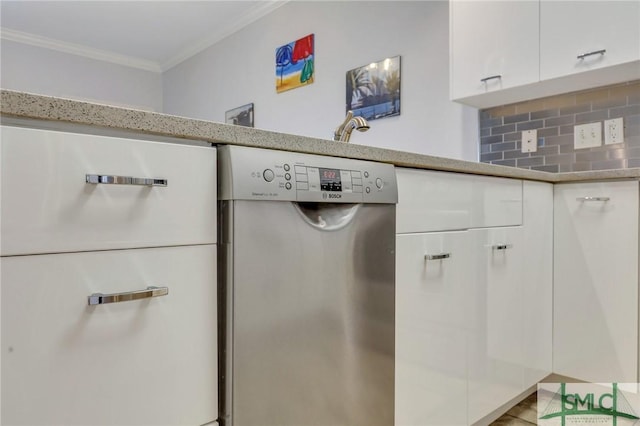 interior details featuring white cabinetry, ornamental molding, tasteful backsplash, and dishwasher