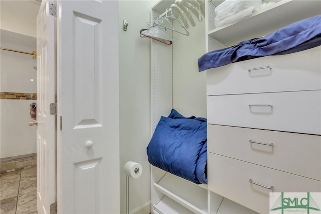 walk in closet featuring light tile patterned floors