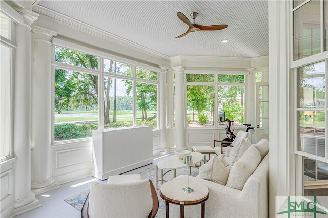 sunroom with ceiling fan