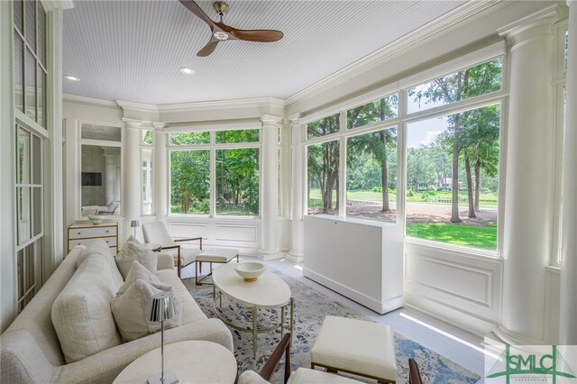 sunroom featuring ceiling fan