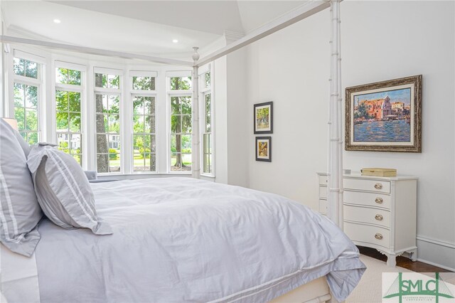 carpeted bedroom featuring vaulted ceiling