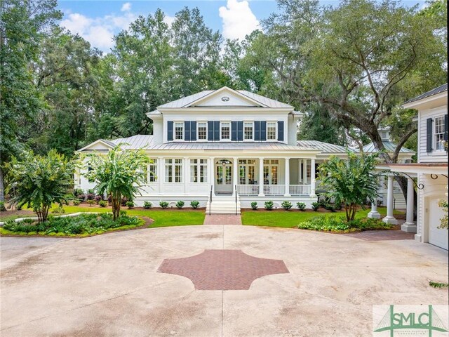 view of front of property with a garage and covered porch