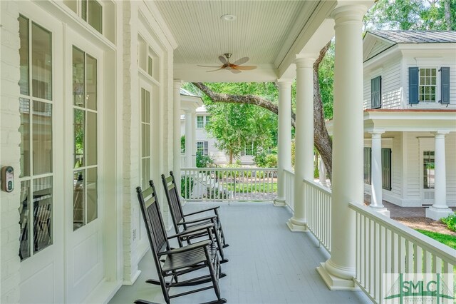 balcony featuring ceiling fan and a porch