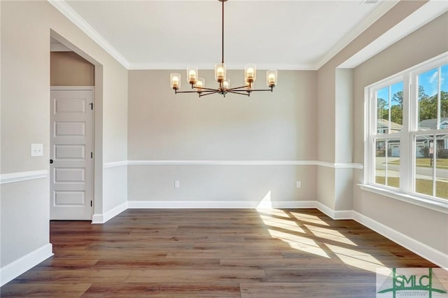 51 Hanover Pl, Richmond Hill, GA 31324 - unfurnished dining area with a chandelier, ornamental molding, baseboards, and wood finished floors