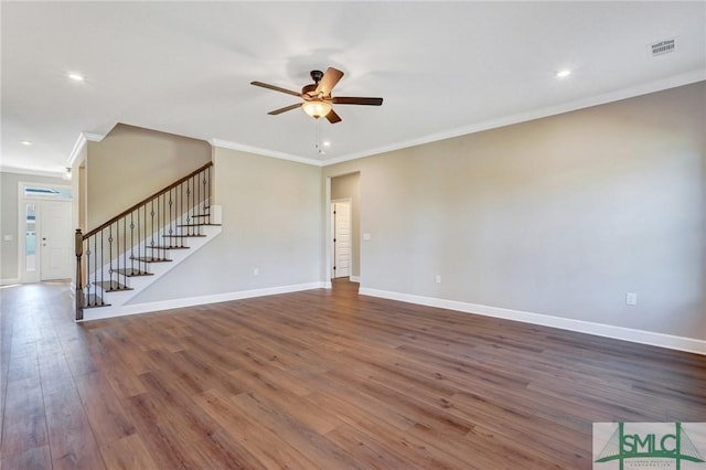 51 Hanover Pl, Richmond Hill, GA 31324 - unfurnished living room with a ceiling fan, stairs, visible vents, ornamental molding, and dark wood-style floors