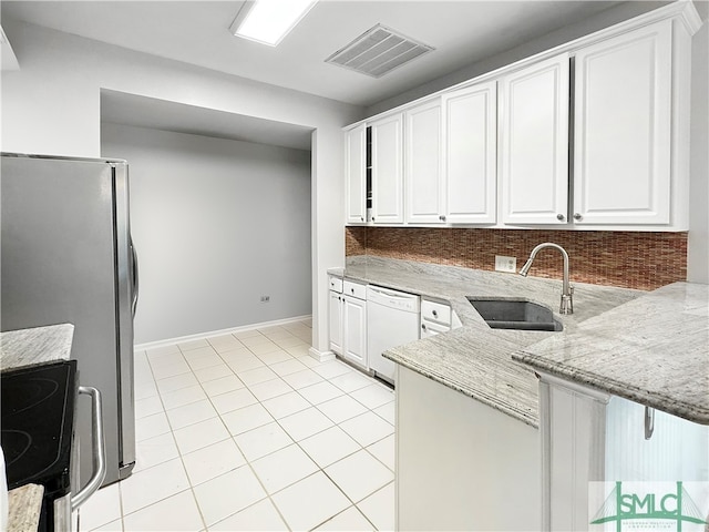 kitchen with white cabinetry, range, sink, and white dishwasher