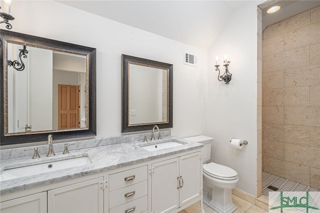 full bathroom featuring toilet, tile patterned flooring, a sink, and visible vents