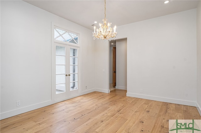 unfurnished room with light wood-type flooring, french doors, baseboards, and recessed lighting