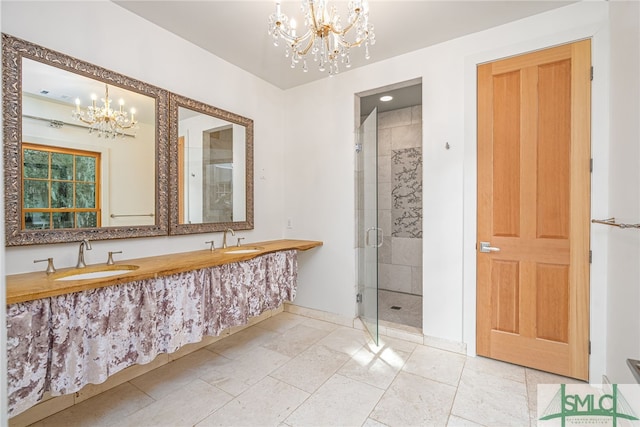 full bath featuring a stall shower, visible vents, a sink, and an inviting chandelier