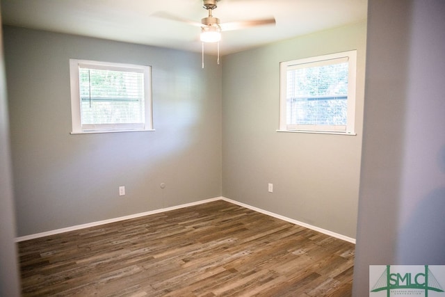 spare room featuring hardwood / wood-style floors and ceiling fan