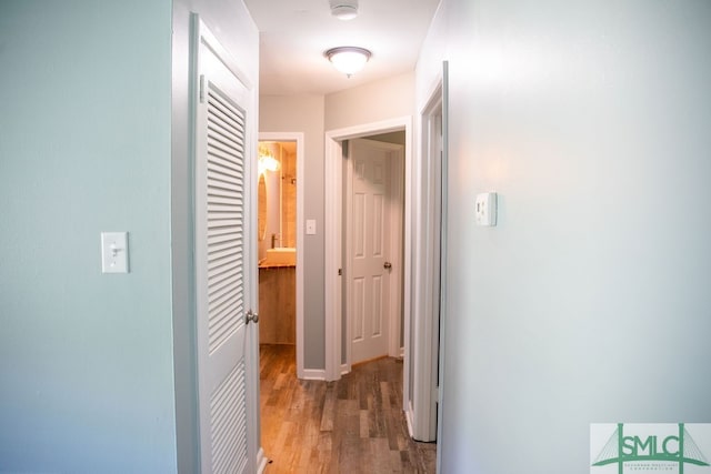 hallway with wood-type flooring