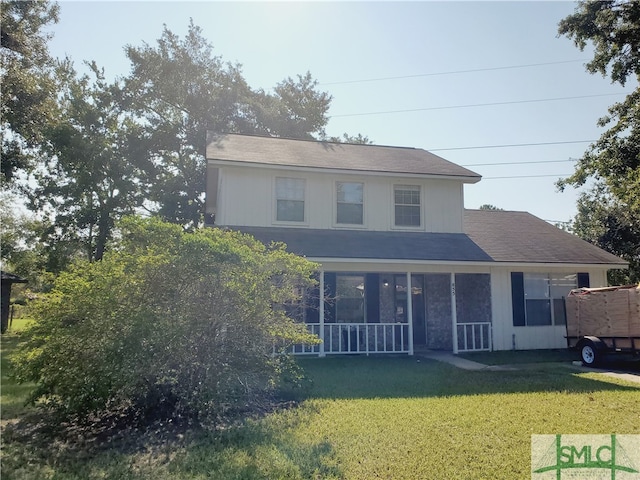 view of property featuring a front lawn