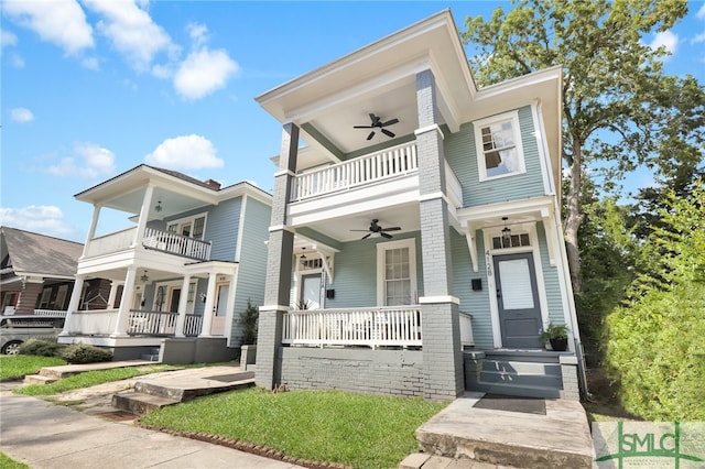 view of front of house with a balcony, a porch, and ceiling fan