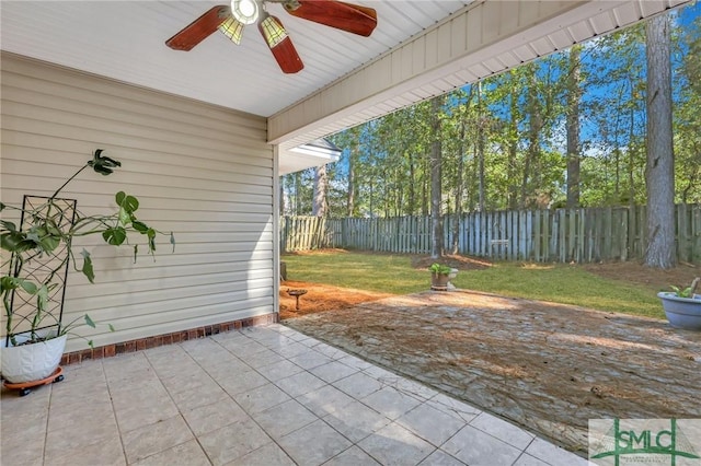 view of patio featuring ceiling fan