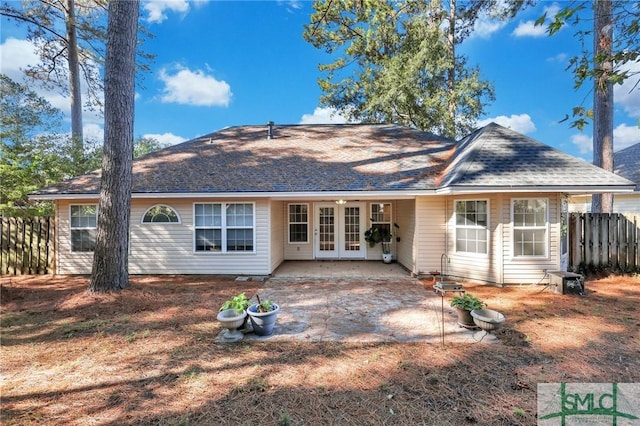 back of property with a patio area and french doors