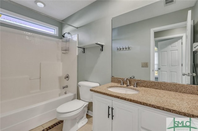 full bathroom with tile patterned floors, vanity, bathing tub / shower combination, and toilet