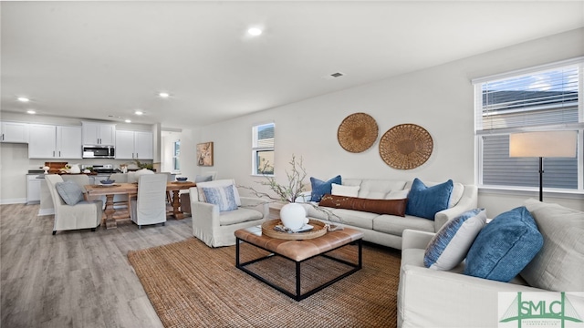 living room with light hardwood / wood-style floors