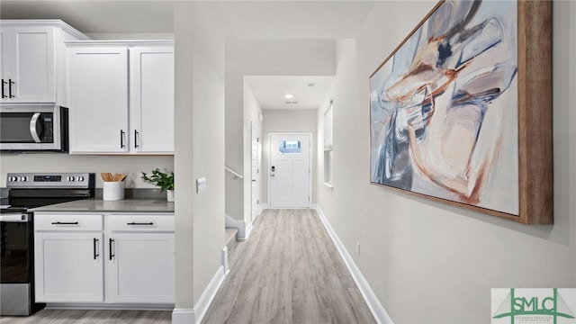 hallway featuring light hardwood / wood-style flooring