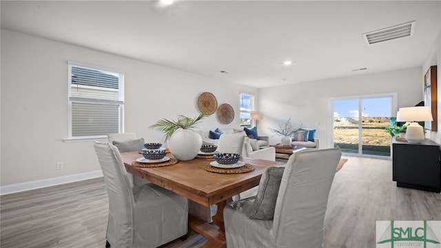 dining area with hardwood / wood-style flooring