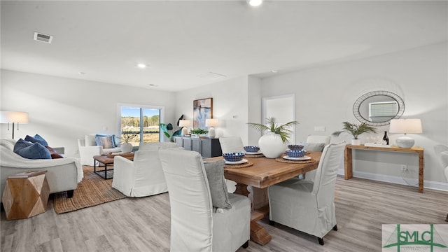 dining area with light hardwood / wood-style flooring