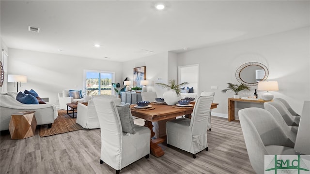 dining area with light wood-type flooring