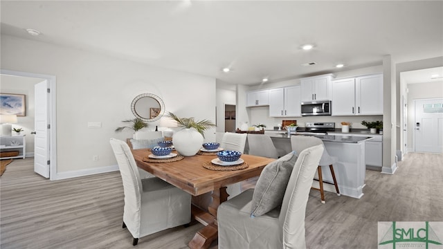 dining room with light hardwood / wood-style flooring