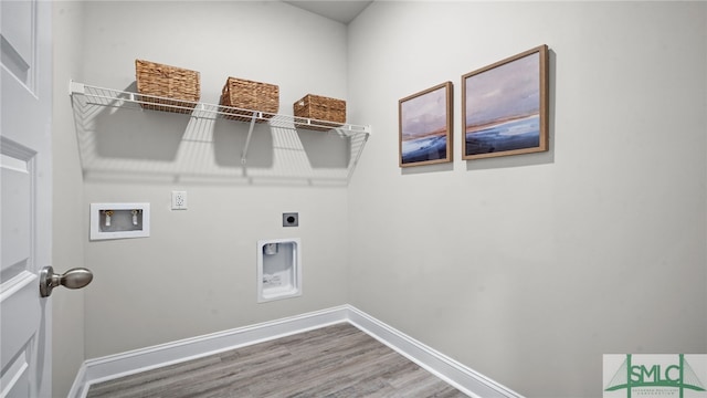 laundry room featuring washer hookup, hookup for an electric dryer, and hardwood / wood-style floors