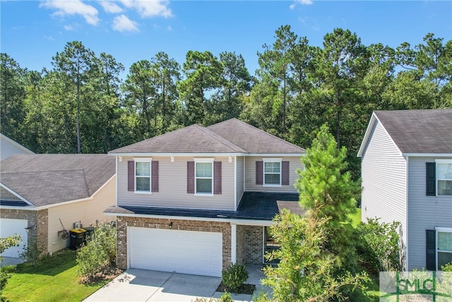 view of front of house featuring a garage, a shingled roof, concrete driveway, cooling unit, and brick siding