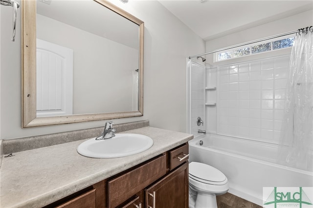 bathroom with toilet, shower / bathing tub combination, and vanity