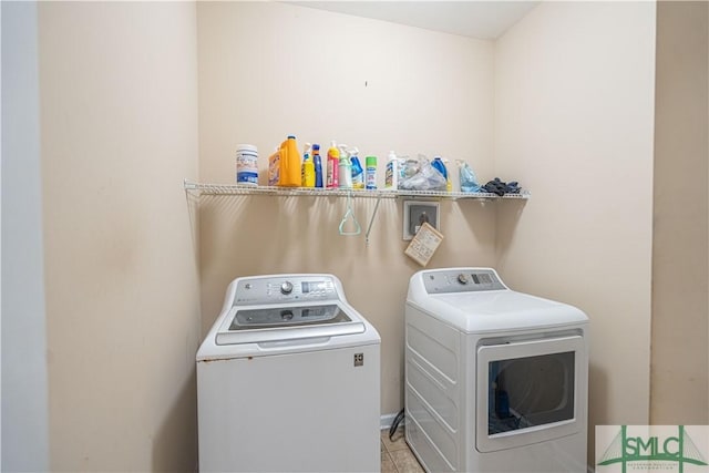 washroom with washing machine and dryer and laundry area