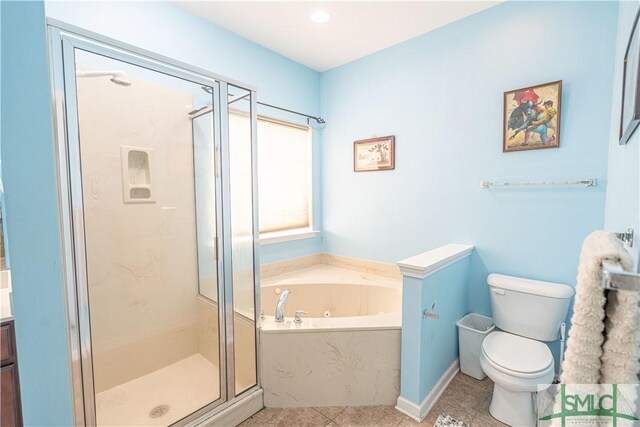 full bathroom with tile patterned flooring, toilet, shower with separate bathtub, and vanity